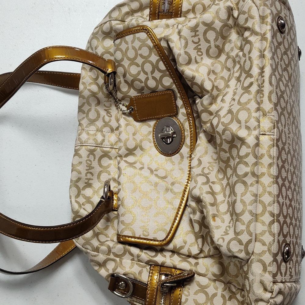 Coach diaper bag with changing pad